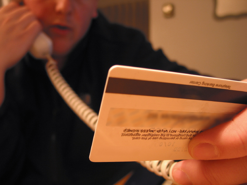 a man holds a credit card